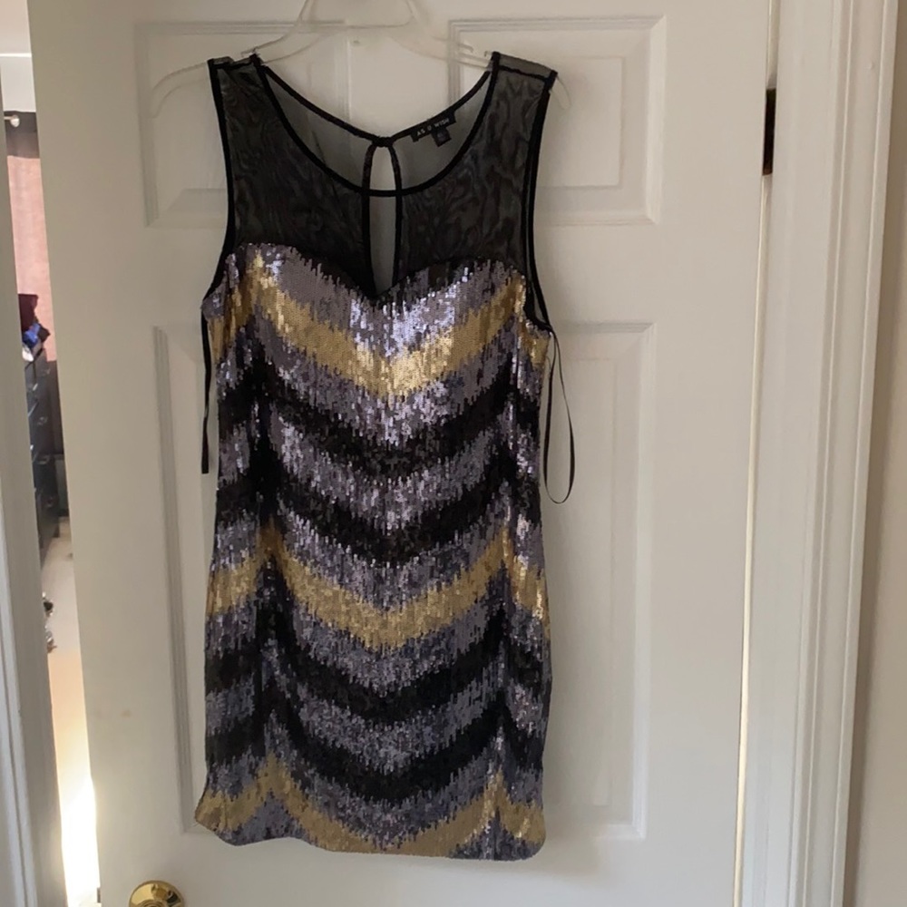 Women’s black and gold sequin dress